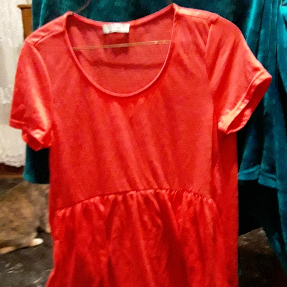 Orange babydoll top.